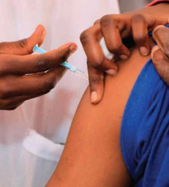 An image of a healthcare provider administering an intramuscular contraceptive injection